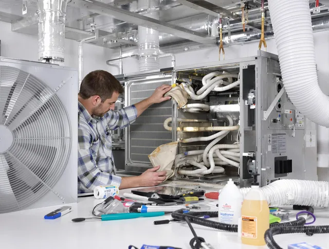 Westwood Air Duct Cleaning specialist performing precision AC coil cleaning in Westwood