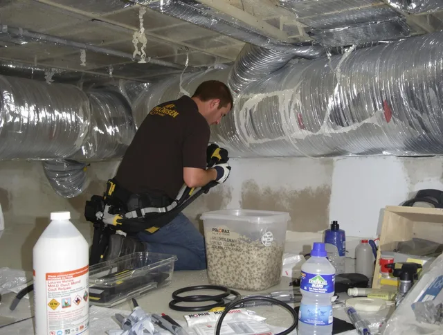 Westwood Air Duct Cleaning specialist performing professional mold removal from air ducts in Westwood