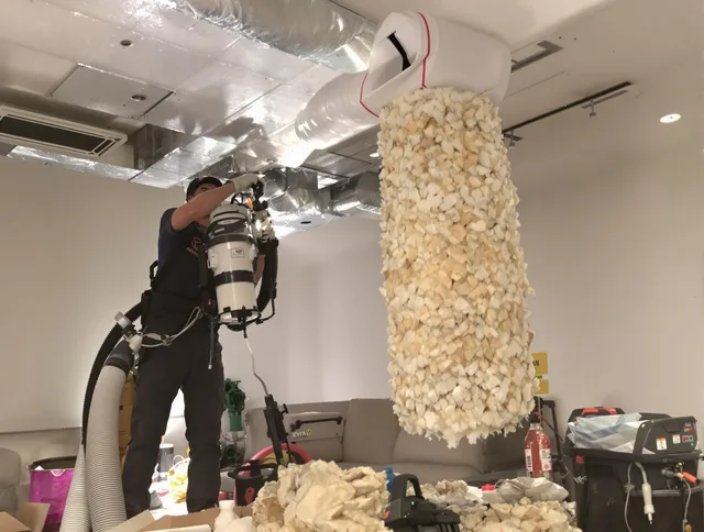 Westwood Air Duct Cleaning technician performing precision vacuum insulation removal in a residential property in Westwood