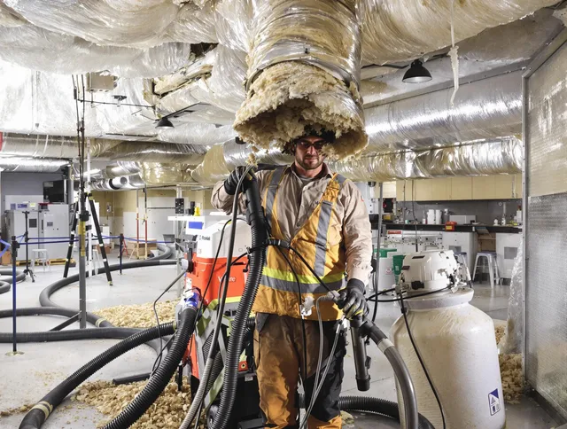 Professional vacuum insulation removal by Westwood Air Duct Cleaning expert in Westwood
